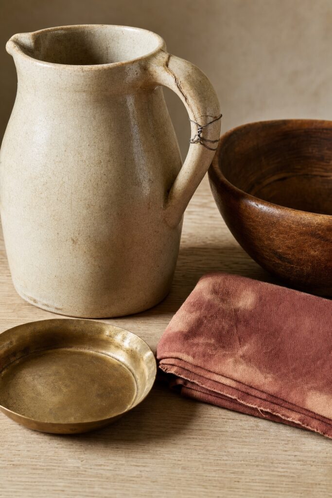Close-up of visibly old boho objects with worn edges a repaired handle and faded dye